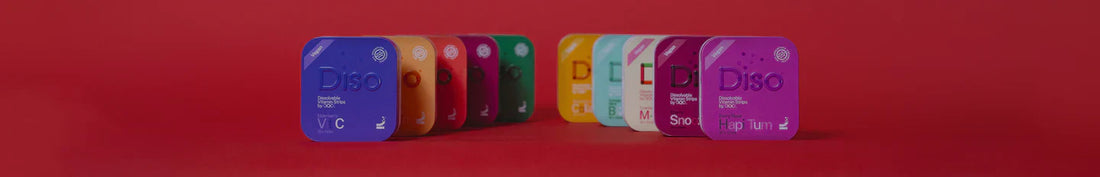 Diso dissolvable vitamin strips displayed next to their packaging on a clean surface