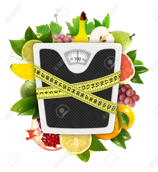 Warm herbal tea surrounded by fresh herbs and spices on a wooden table during winter