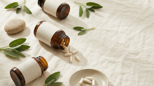 Three premium magnesium glycinate supplement bottles in a flat-lay with sage leaves and natural morning light