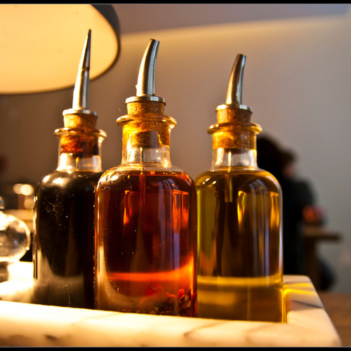 Selection of health-focused vinegars including apple cider and speciality varieties at Onelife Health