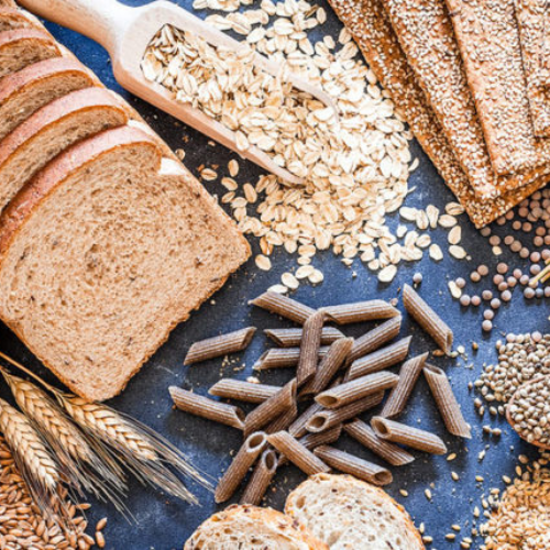 Selection of wholesome grains including quinoa, oats, and rice from Onelife Health